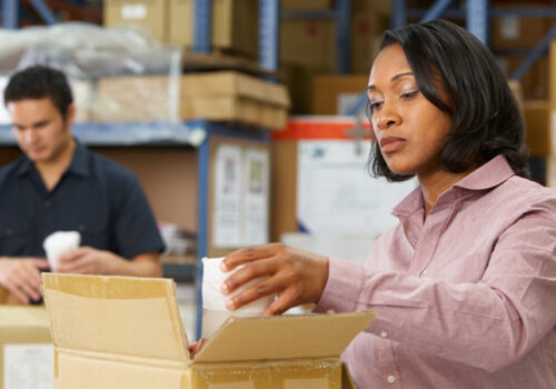 warehouse employees repackaging